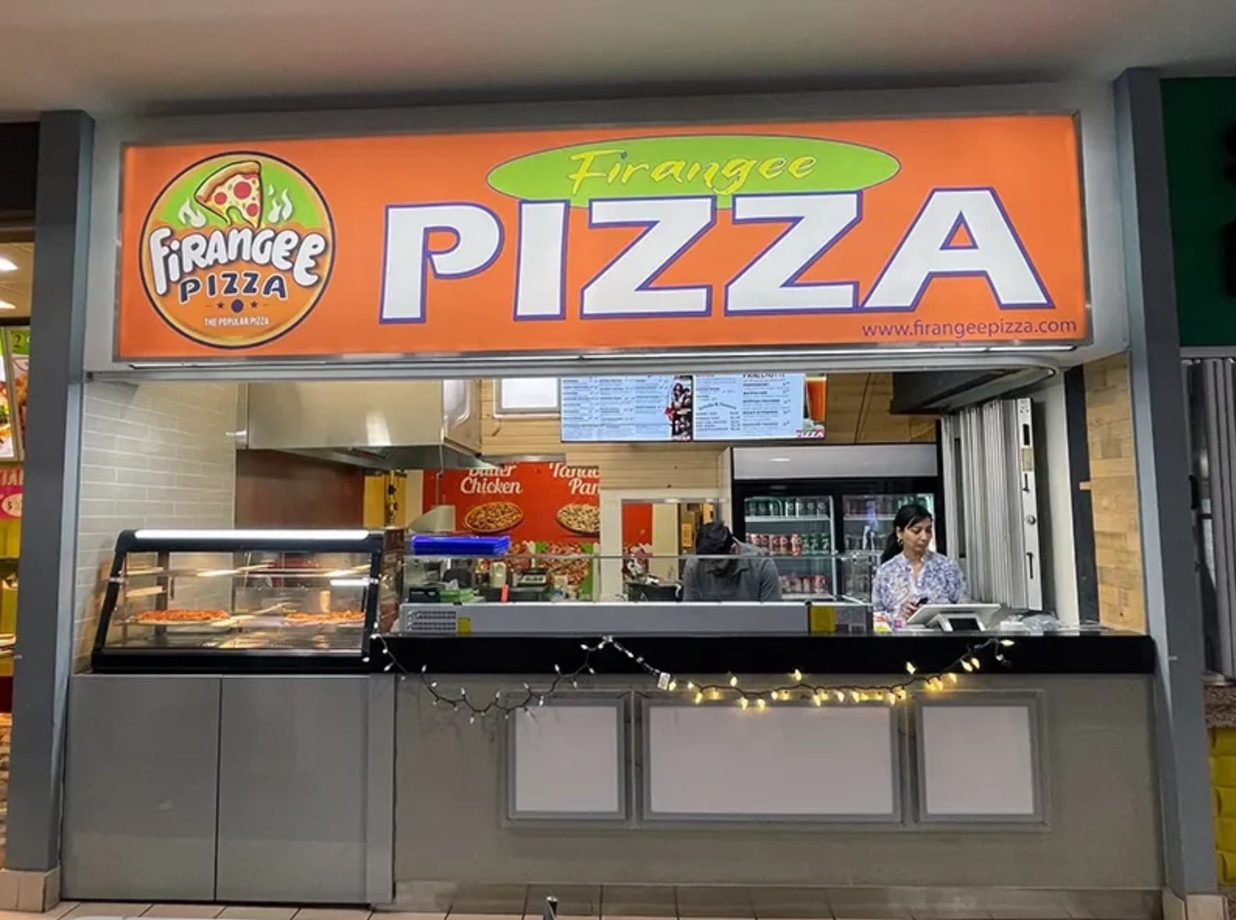 Chef stretching pizza dough in the kitchen